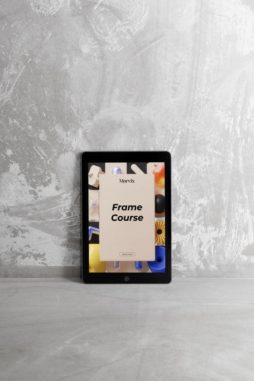 Digital tablet displaying a Merture Frame Course on a gray surface with a textured wall background
